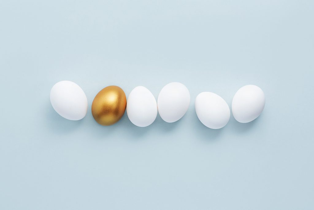 golden egg with white eggs
